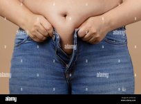 obese-lady-with-big-abdomen-trying-to-zip-up-jeans-of-blue-colour-visceral-fat-body-positive-s...jpg