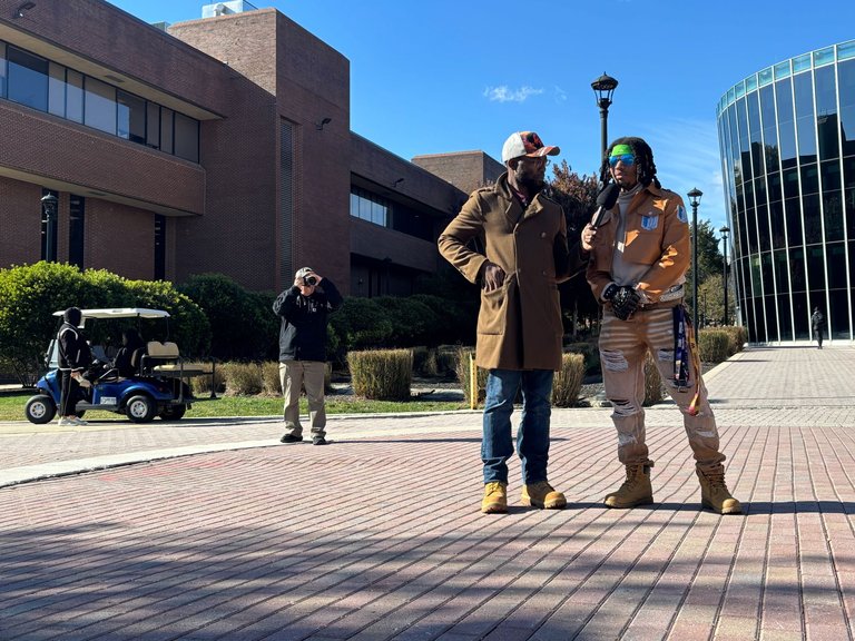 Two men at Bowie State University campus during Blexit tour