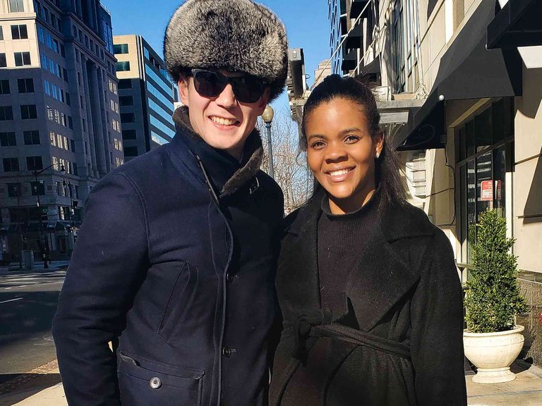 Candace Owens and George Farmer smiling outdoors in winter coats
